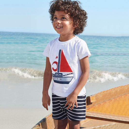 Child wearing a short-sleeve cotton shirt and matching elastic-waist shorts summer set