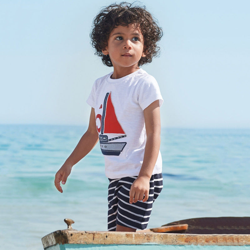 Child wearing a short-sleeve cotton shirt and matching elastic-waist shorts summer set