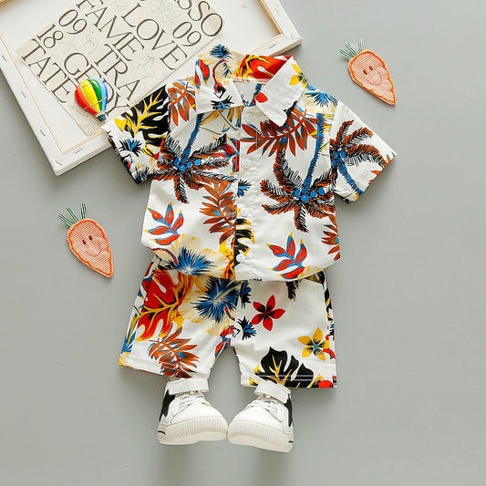 Child wearing floral cotton short-sleeve shirt and elastic-waist shorts two-piece summer suit