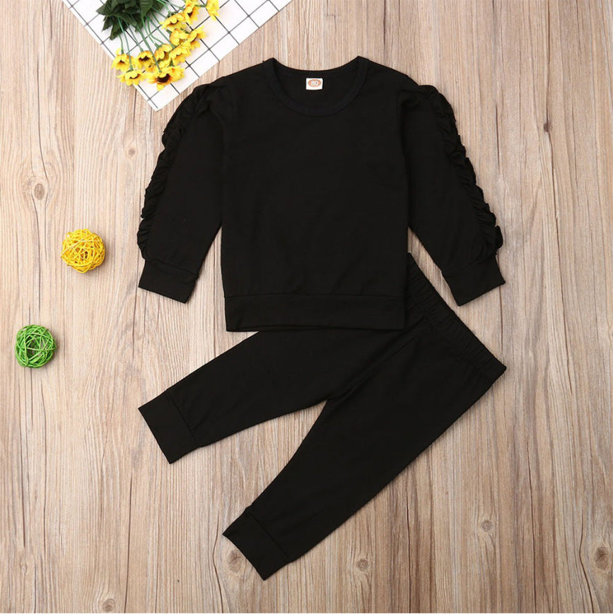 Newborn baby girl in ruffle sweatshirt and pants outfit