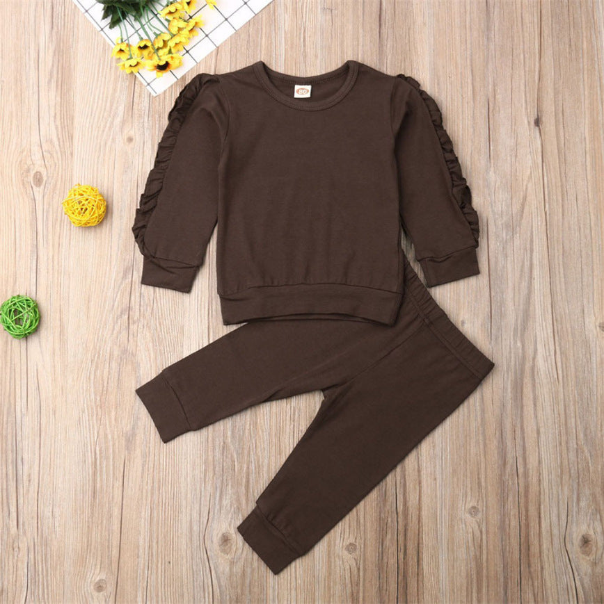 Newborn baby girl in ruffle sweatshirt and pants outfit
