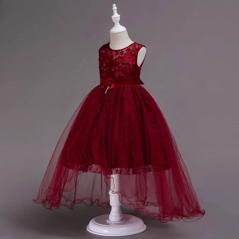 Girl wearing red Christmas dress with lace details